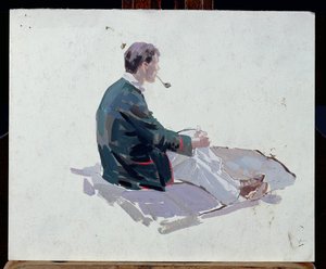 Man sitting upon rocks smoking a pipe